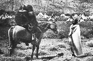 Indians Riding Double on a horse.
